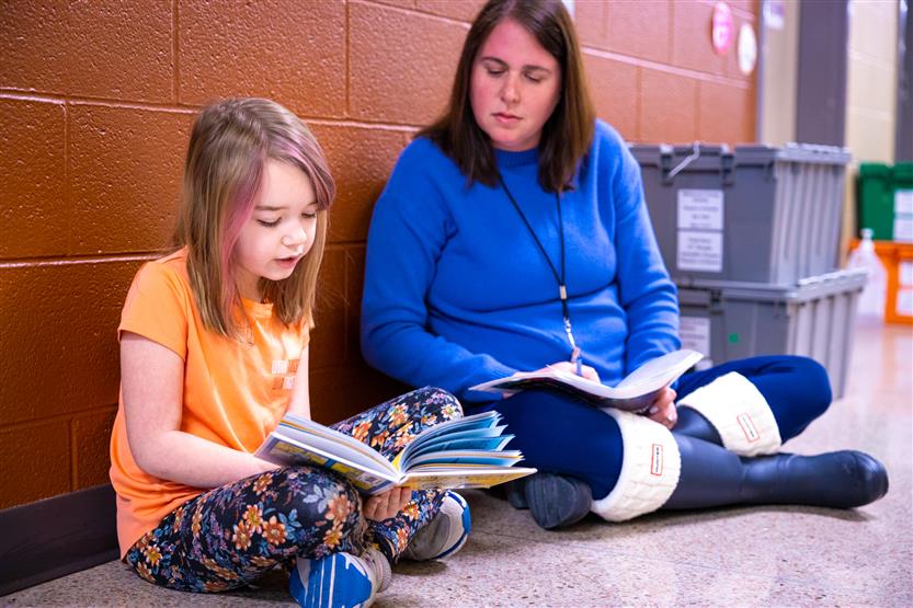 Students read to volunteers